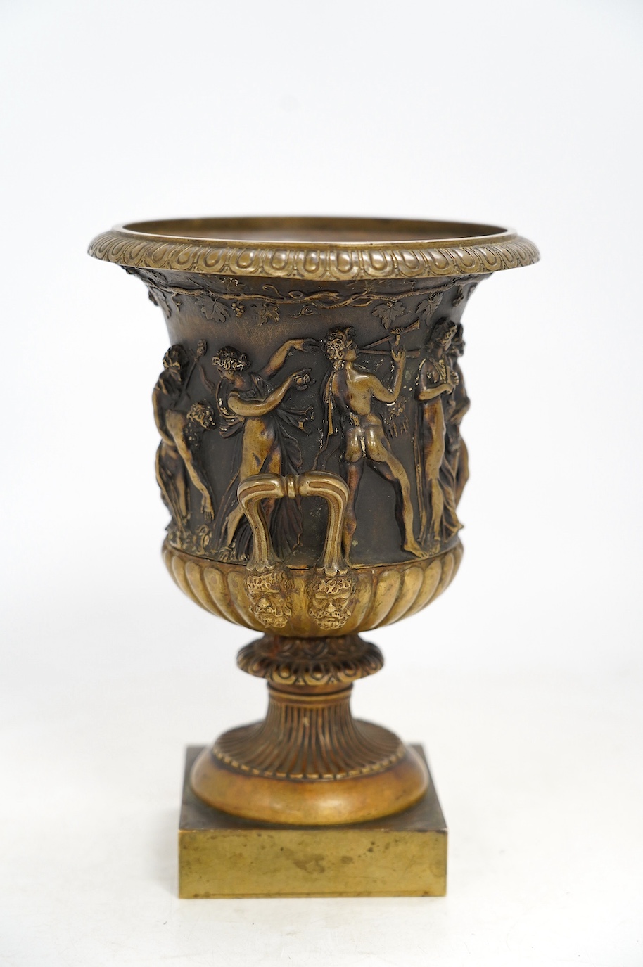 A mid 19th century bronze campana urn with classical figures, 22cm high. Condition - good